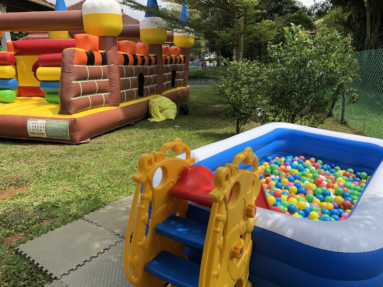 Ball pit set up next to a bouncy castle